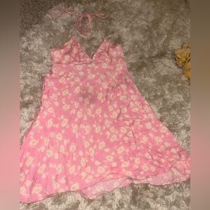 Pink mini dress, with white detailing. Satin like material.